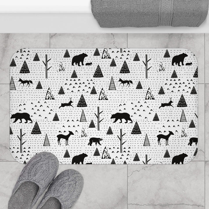 Animal print bath mat with slippers for scale