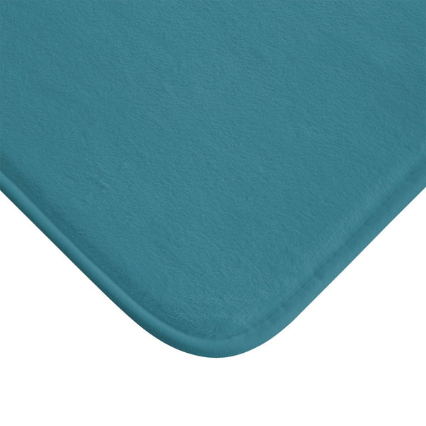 Close up of corner of teal bath mat