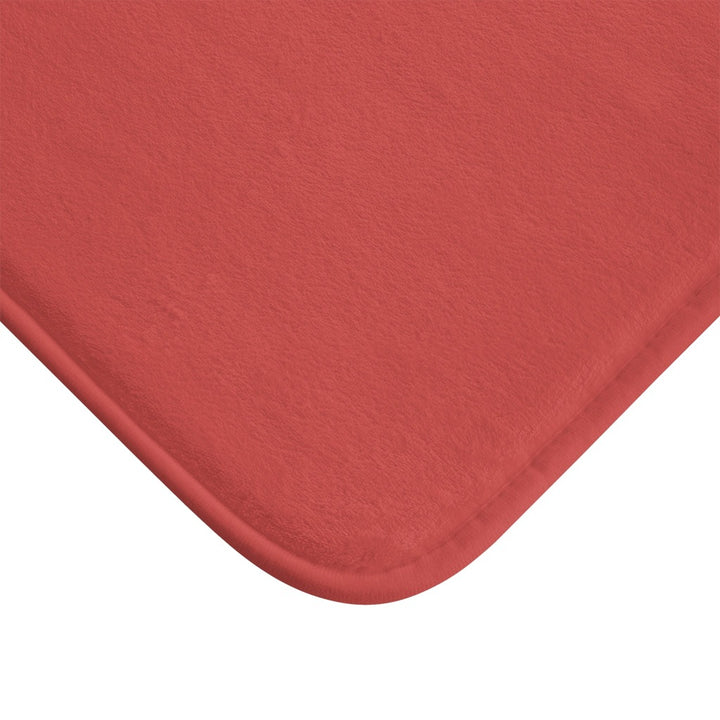 close up of orange red bath mat