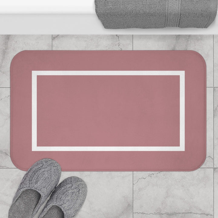 pink and white bath mat