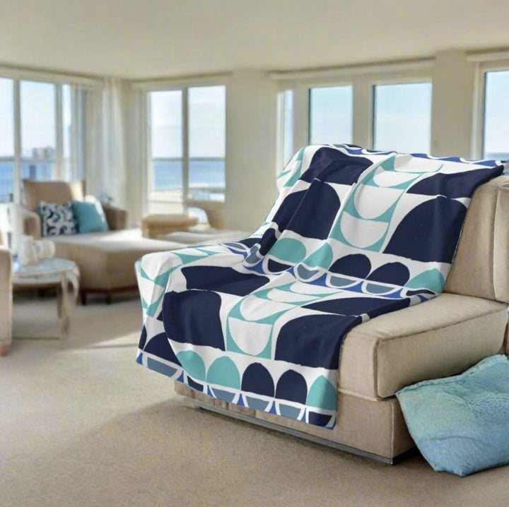 blue grey and turquoise throw blanket in nice condo