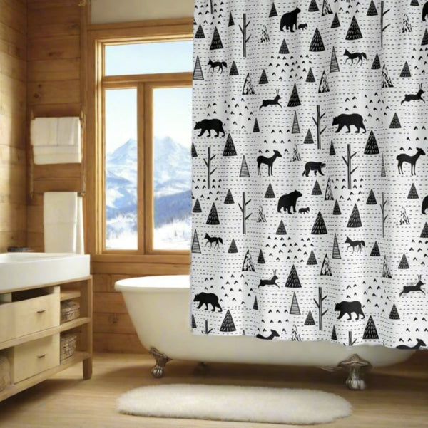 bland and white animal print shower curtain in rustic bathroom with snowy view