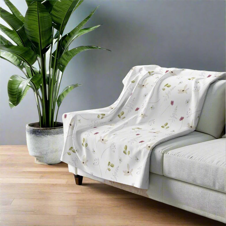 Gift idea elegant floral blanket on a sofa