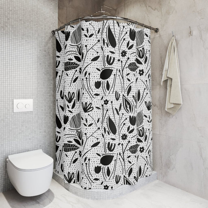 black and white modern floral design on a shower curtain in a cute bathroom