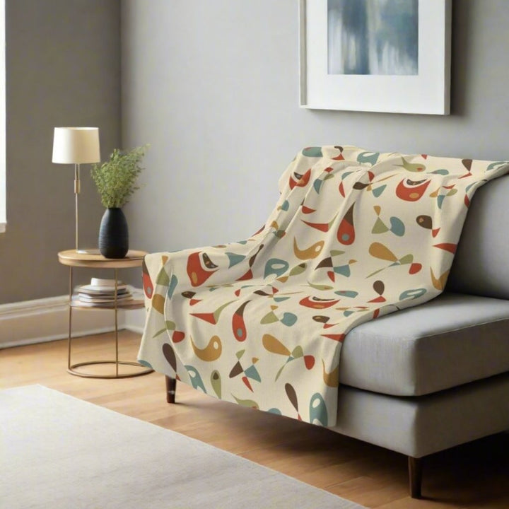 mid century fleece blanket on a chair in modern living room