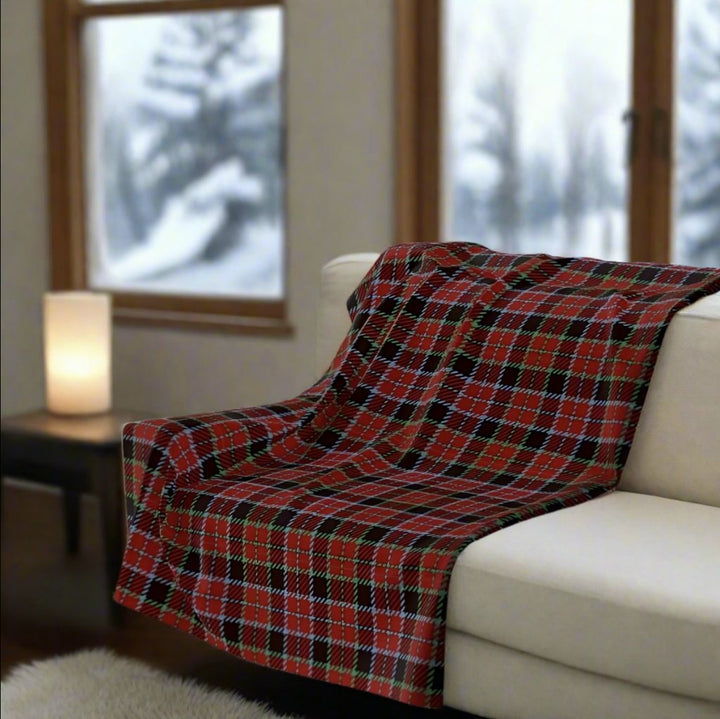 Cool red plaid throw blanket on a white sofa