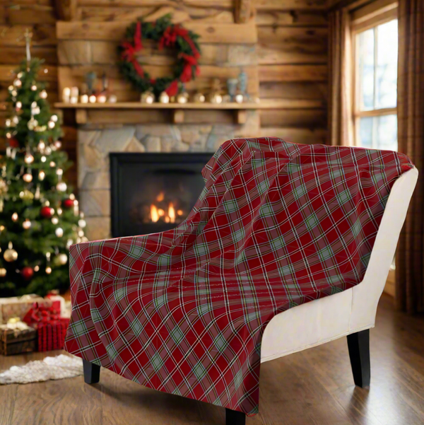 plaid-throw blanket on a white chair in a christmas living room