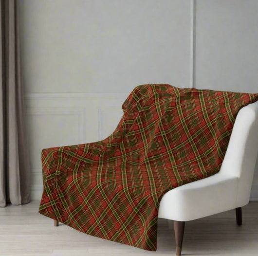 plaid throw blanket on white leather chair