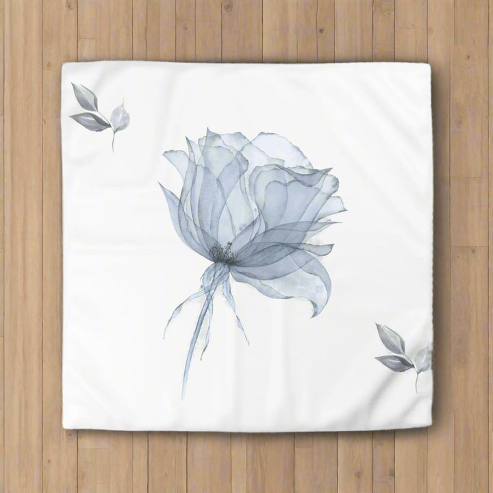 Hand painted floral design of a blue and grey flower on a white duvet cover 