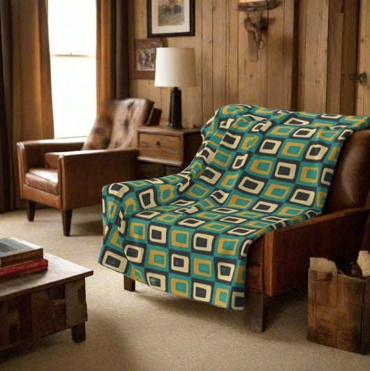 stylish teal and gold mid century throw blanket in classic living room