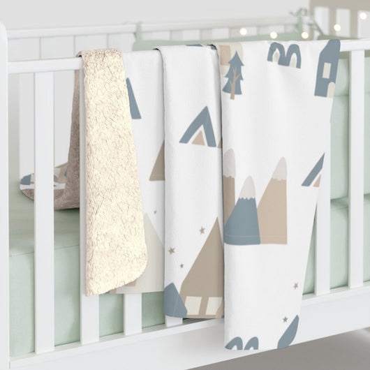 scandi design on a blanket over a crib